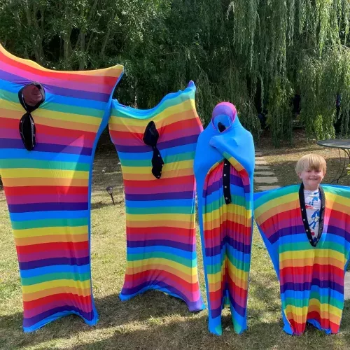 Body socks shown in differnt sizes and in a colourful rainbow design